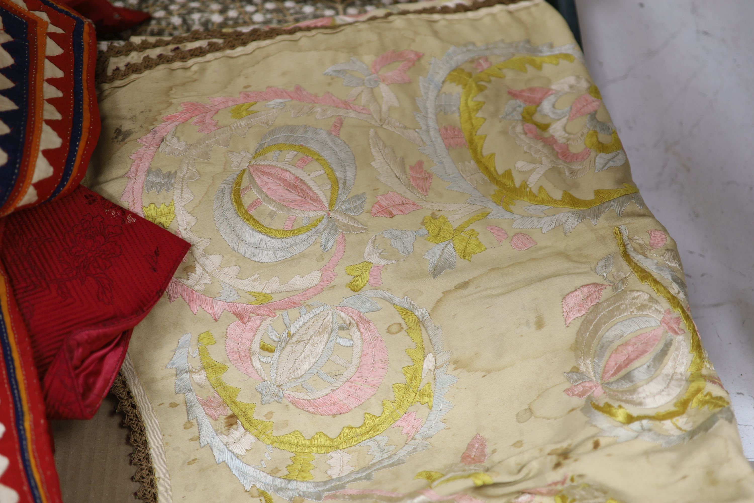 A red brocade dressing gown, embroidered silk runner, Indian panel, Liberty Morris style fabric etc